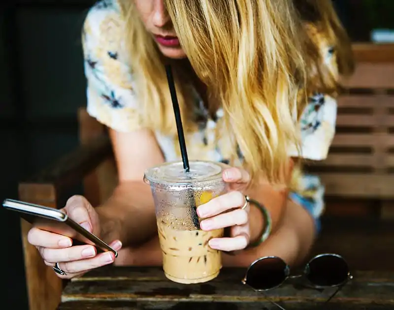 woman-drinking-iced-coffee_jumpstory